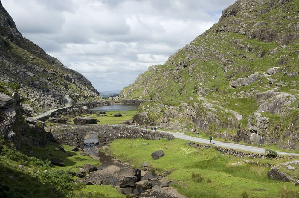 stone bridge with rocky and green landscape 